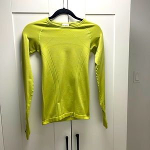 This long sleeve is from ivivva, a size medium and is green.